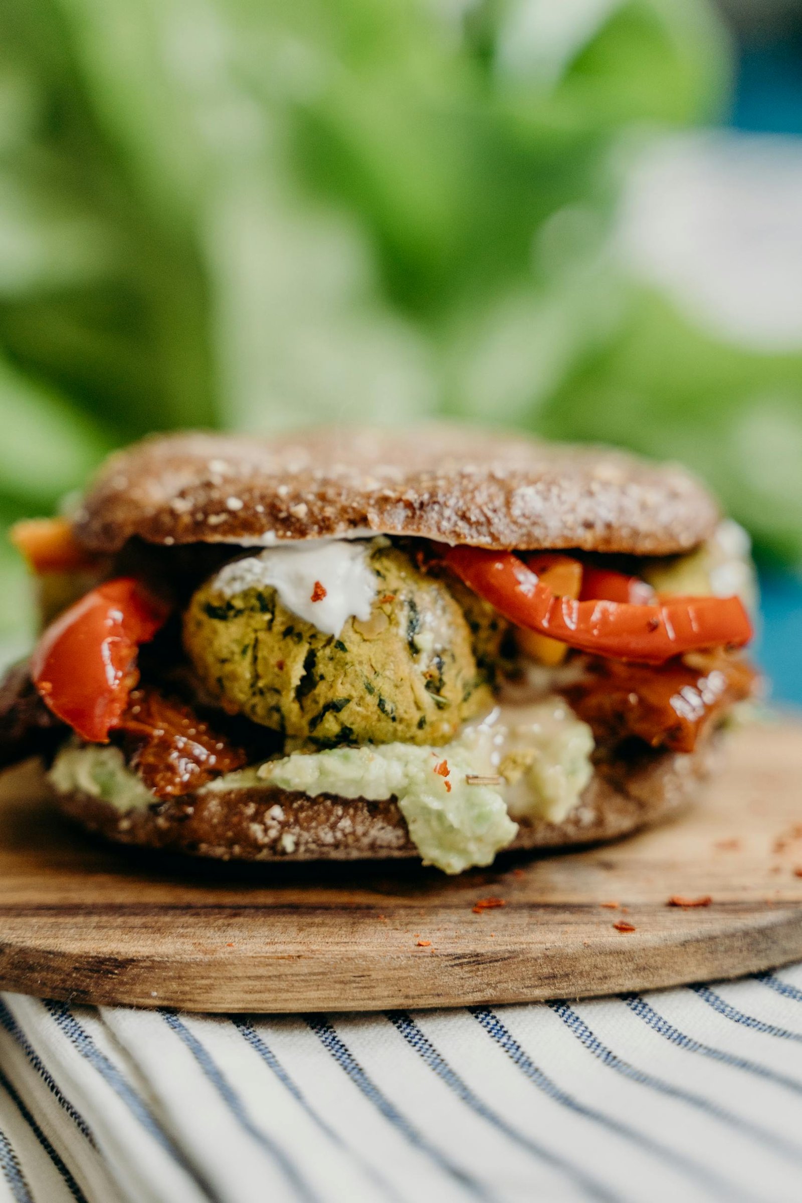 A mouthwatering vegan falafel burger with fresh ingredients, perfect for a healthy meal.